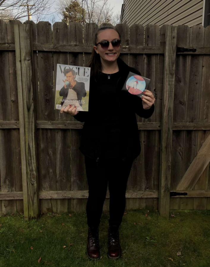 Samantha Cable, a senior at Winslow High, (pictured) enthusiastically displays Styles’ Vogue Magazine cover alongside Styles’ Fine Line album.